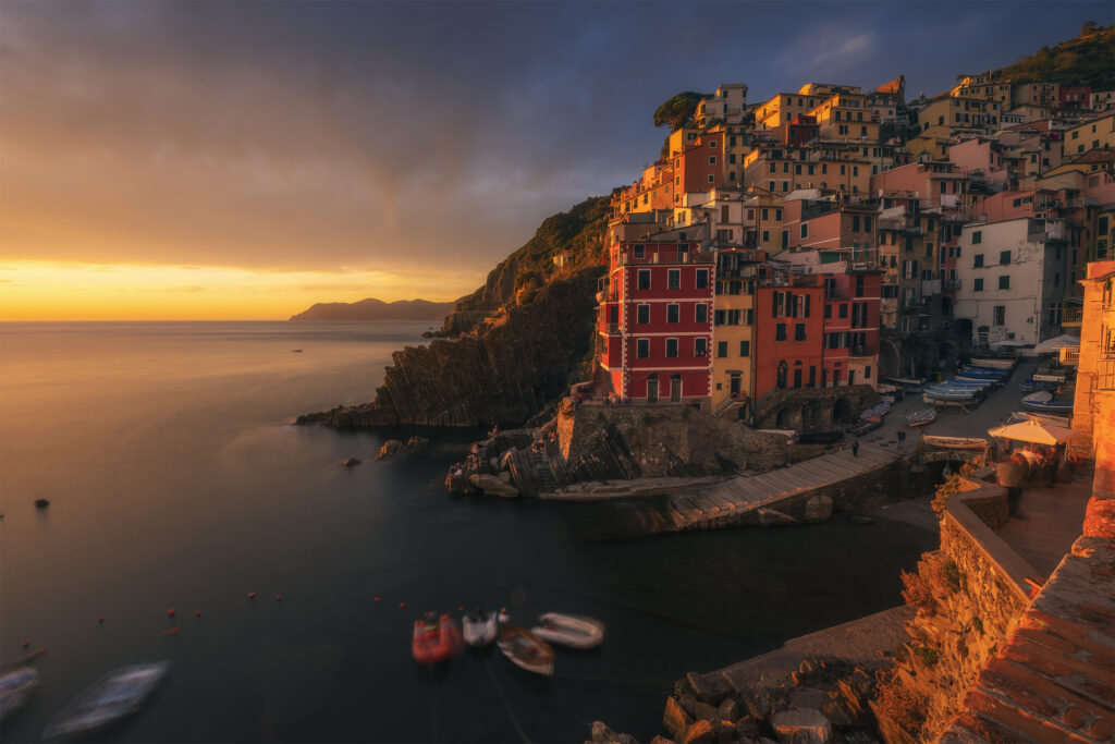 Riomaggiore at sunset with colourful houses and boats, Cinque Terre